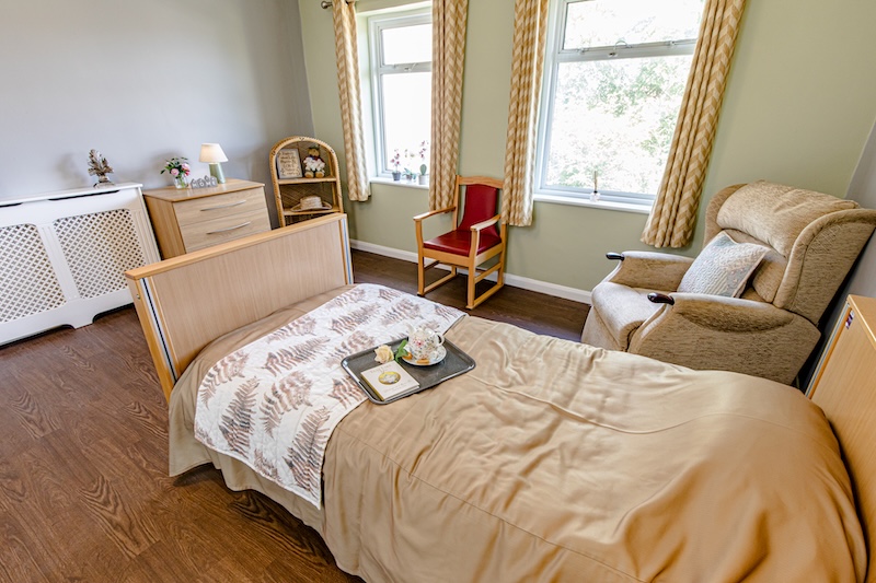 Bedroom at the Willows with large bright window