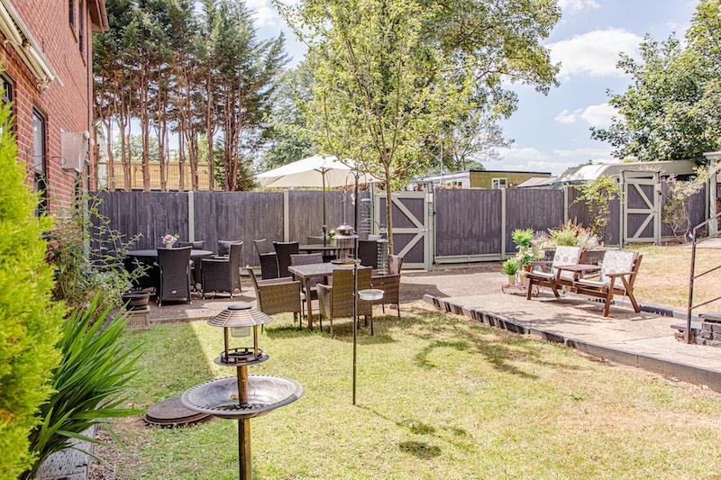 Outdoors garden area with furniture at the Willows